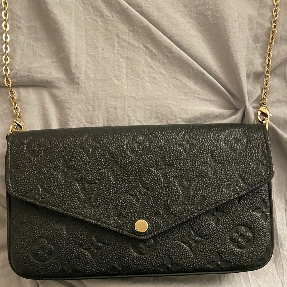 Black POCHETTE FELICIE EMPREINTE. Used but in new condition. Only used twice